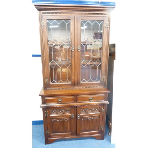 248 - Old Charm oak display cabinet on cupboard base.