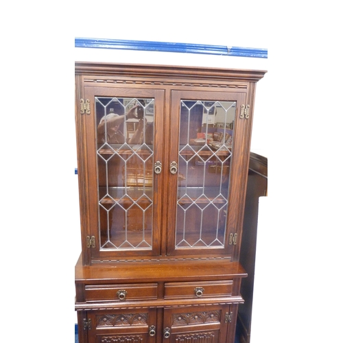 248 - Old Charm oak display cabinet on cupboard base.