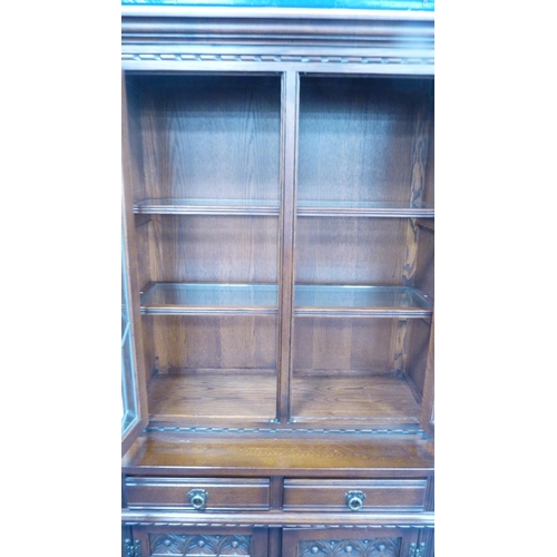 248 - Old Charm oak display cabinet on cupboard base.