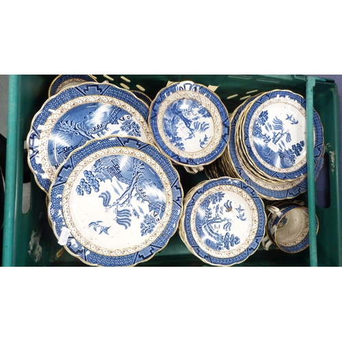 33 - Two cartons containing a large quantity of Booth's 'Real Old Willow' pattern table and dinnerwares, ... 