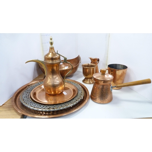 43 - Group of copper wares to include trays, Middle Eastern-type pot, beakers etc.