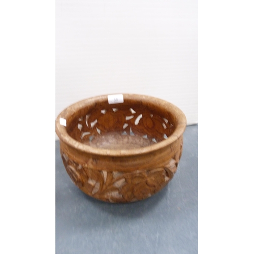 55 - Indian-style carved wooden bowl on folding stand.