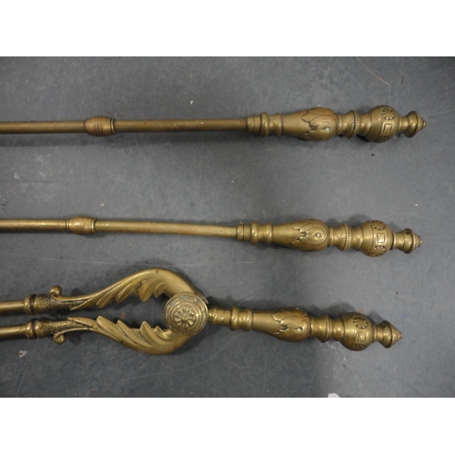 74 - Set of three brass fire irons with set of tongs and pair of brass fire dogs.