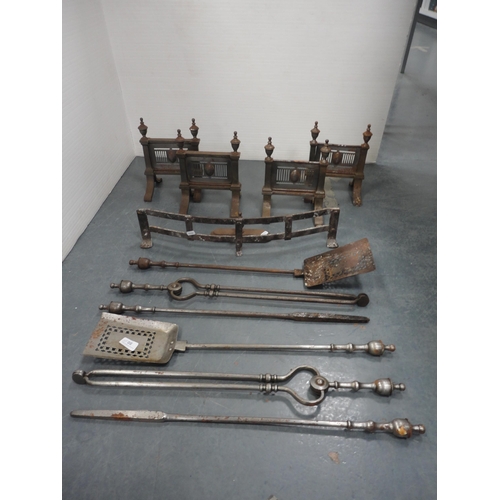 80 - Two sets of three steel fire irons with similar period fire dogs and accessories.