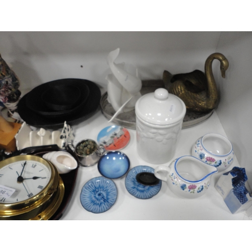 86 - Shelve lot of sundries to include brass swan planter, china, wall clock etc