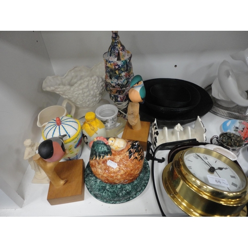 86 - Shelve lot of sundries to include brass swan planter, china, wall clock etc