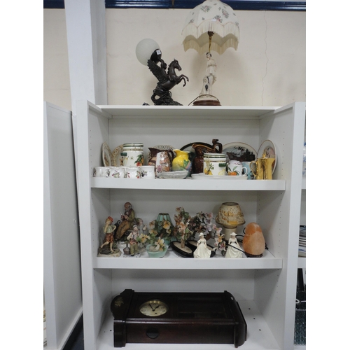 90 - Three shelves of assorted ceramics, table lamps and wall clock.