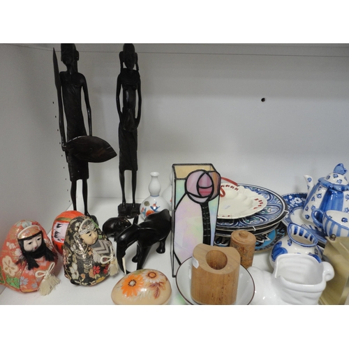 99 - Shelf lot to include sundry ceramics, carriage clock and tribal figures etc