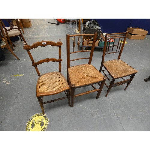 519 - Three antique rush seat dining chairs.