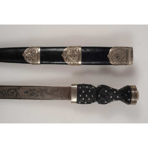 1674 - Early 20th century Scottish pipers dirk having white metal mounts, the blade with etched designs of ... 