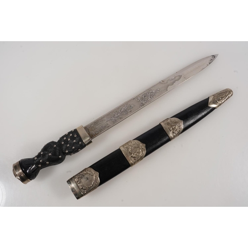 1674 - Early 20th century Scottish pipers dirk having white metal mounts, the blade with etched designs of ... 