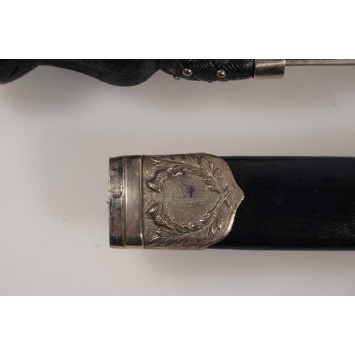 1674 - Early 20th century Scottish pipers dirk having white metal mounts, the blade with etched designs of ... 