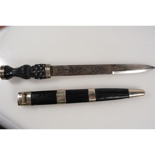 1674 - Early 20th century Scottish pipers dirk having white metal mounts, the blade with etched designs of ... 