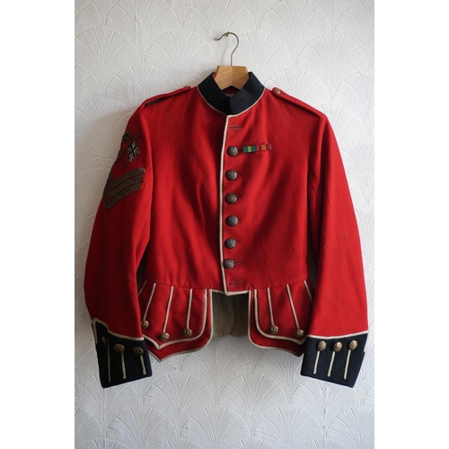 1746 - British army uniform, a red doublet jacket having medal ribbons for Territorial efficiency medal and... 