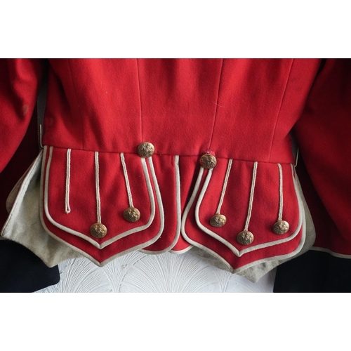 1746 - British army uniform, a red doublet jacket having medal ribbons for Territorial efficiency medal and... 