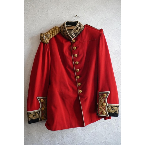 1752 - British army uniform, a red tunic jacket with brass buttons, bullion wire knot epaulette with insign... 