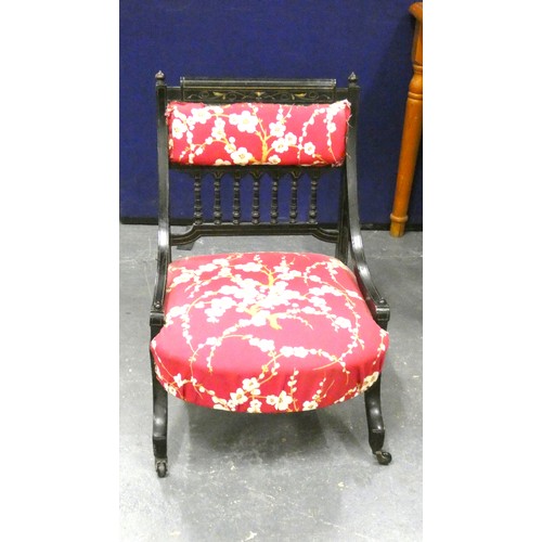 195 - Victorian ebonised nursing chair.