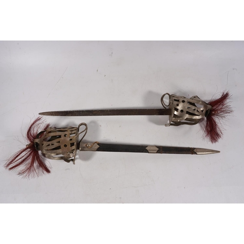 1699 - Pair of children's size swords modelled on a Scottish basket hilted broadsword, blade length 38cm, s... 