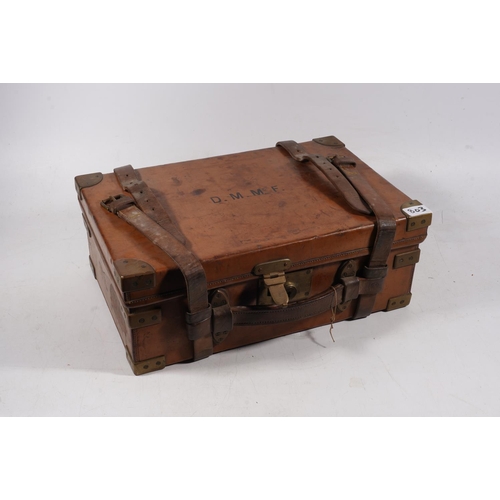 1764 - Brass bound brown leather clad cartridge case with sectional interior bearing label 'Army & Navy... 