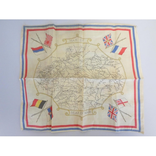 310 - WW1 militaria to include regimental badges, a Royal Army Medical Corps silk postcard, a WW1 map of E... 