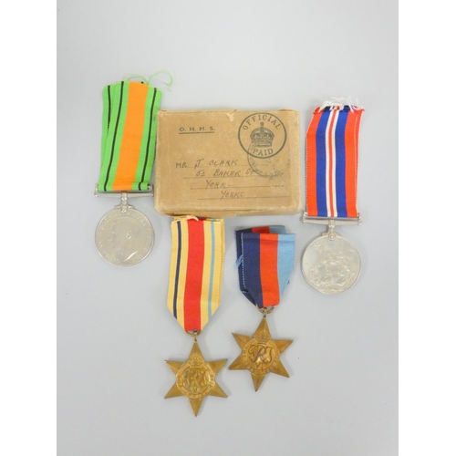 315 - WW2 British medal group comprising of a Defence Medal, 1939-45 Medal, 1939-45 Star and Africa Star, ... 