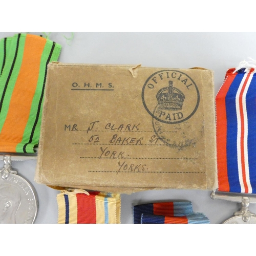 315 - WW2 British medal group comprising of a Defence Medal, 1939-45 Medal, 1939-45 Star and Africa Star, ... 