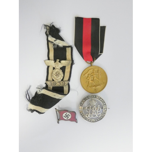 304 - Military Awards. Awards group to include a 1939 clasp for the Iron Cross 2nd class, a NSDAP party fl... 