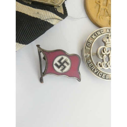 304 - Military Awards. Awards group to include a 1939 clasp for the Iron Cross 2nd class, a NSDAP party fl... 