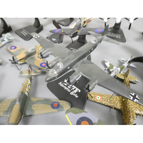 102 - Atlas Editions. Box of loose model aircraft many with stands to include a Supermarine Spitfire MKI, ... 