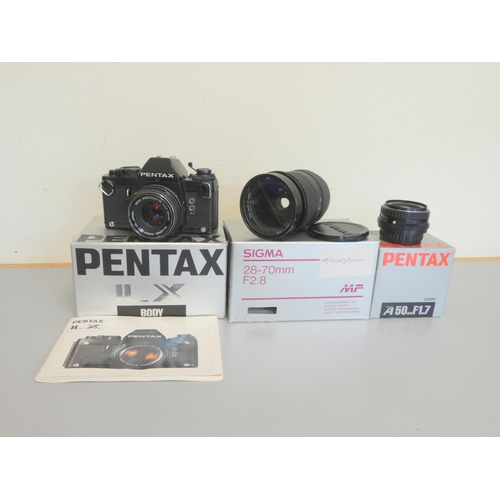 387 - Pentax LX boxed SLR camera with 50mm F1.7 lens, along with a Sigma 28-70mm F2.8 lens and a Pentax 50... 