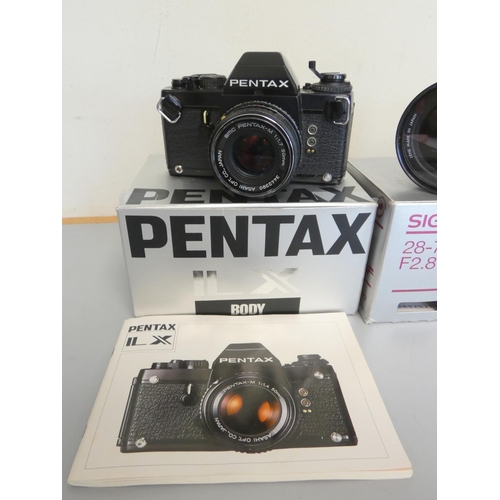 387 - Pentax LX boxed SLR camera with 50mm F1.7 lens, along with a Sigma 28-70mm F2.8 lens and a Pentax 50... 