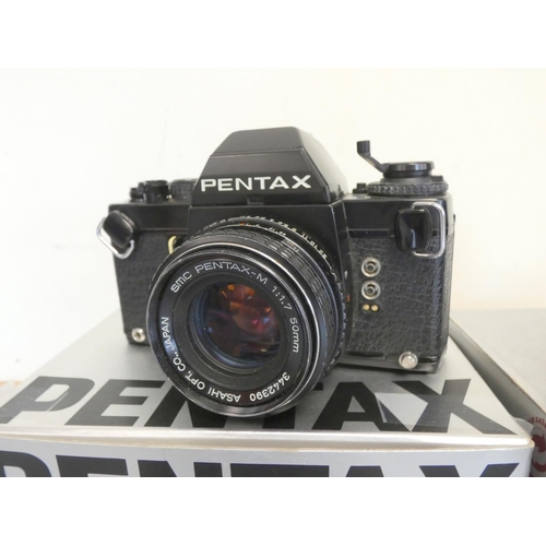 387 - Pentax LX boxed SLR camera with 50mm F1.7 lens, along with a Sigma 28-70mm F2.8 lens and a Pentax 50... 