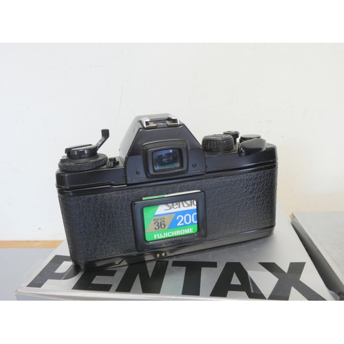 387 - Pentax LX boxed SLR camera with 50mm F1.7 lens, along with a Sigma 28-70mm F2.8 lens and a Pentax 50... 