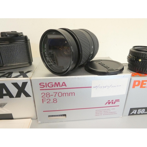 387 - Pentax LX boxed SLR camera with 50mm F1.7 lens, along with a Sigma 28-70mm F2.8 lens and a Pentax 50... 