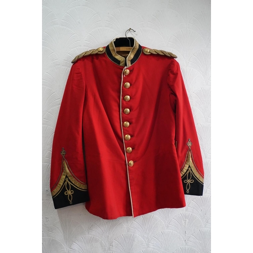 1751 - British army uniform, a red tunic jacket having The Queens Royal West Surrey Regiment brass buttons,... 