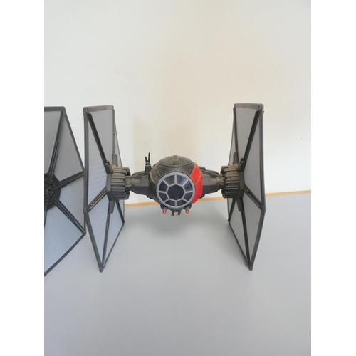 175 - Star Wars. Three model starfighters to include a Tie Striker Hasbro 2016, First Order Special Forces... 