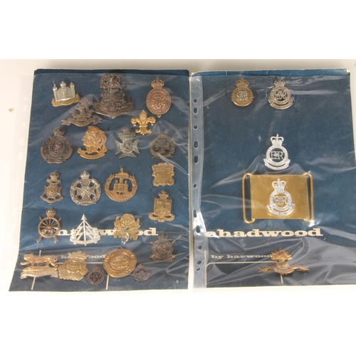 1629 - Large collection of regimental insignia to include a Sandhurst Royal Military Academy waist belt buc... 