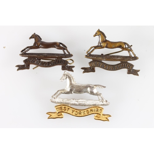 1656 - Fine diecast white metal West Yorkshire regiment cap badge by Gaunt of London, two others in brown m... 