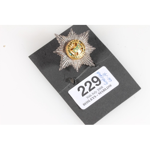 1657 - Fine diecast unhallmarked white metal and enamel Irish Guards cap star, 4.3cm tall, 15g. Provenance:... 