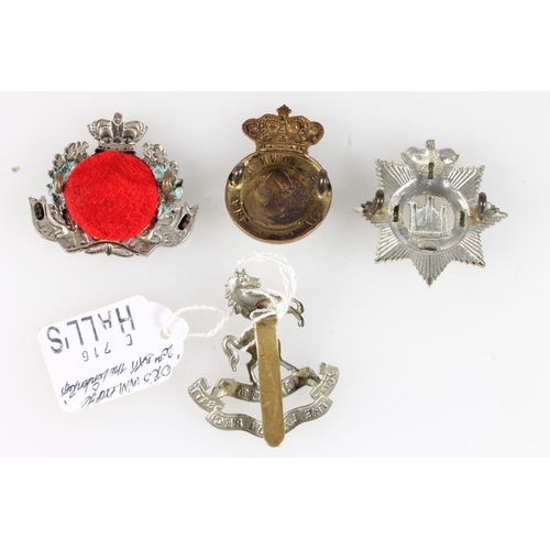 1660 - White metal cap badge of the Suffolk Regiment. Provenance: Bosleys Lot 60 30th July 2008. Brass cap ... 