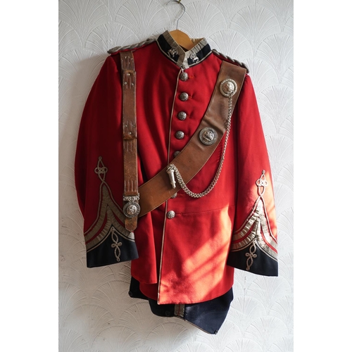 1749 - British army uniform, a red tunic jacket with Robert Gibb of Kirkcaldy label, having Royal Highlande... 