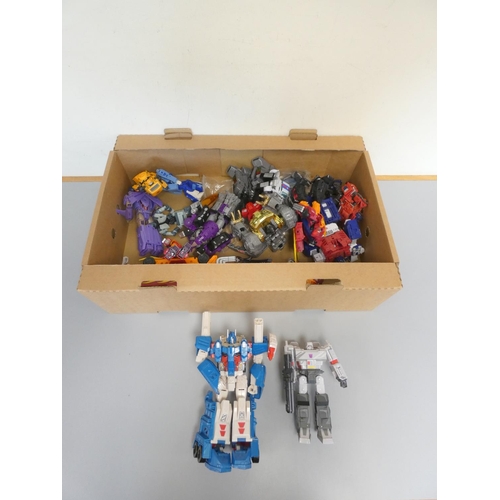 195 - Transformers. Box of contemporary figures to include Ultra Magnus, Megatron and others. ... 