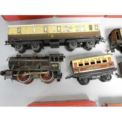 215 - Hornby. Tinplate models to include three boxed 0 gauge No.1 Cattle Trucks, a No.2 LNER black tank lo... 