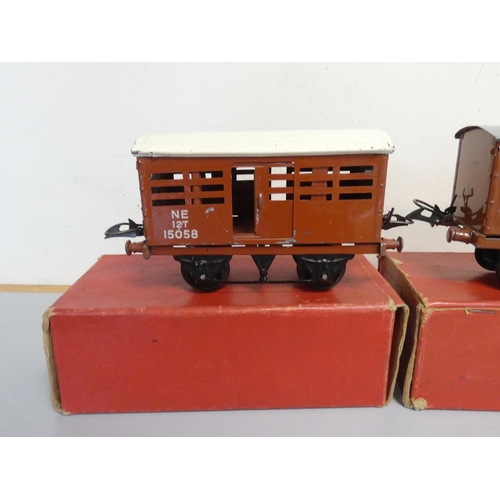 215 - Hornby. Tinplate models to include three boxed 0 gauge No.1 Cattle Trucks, a No.2 LNER black tank lo... 