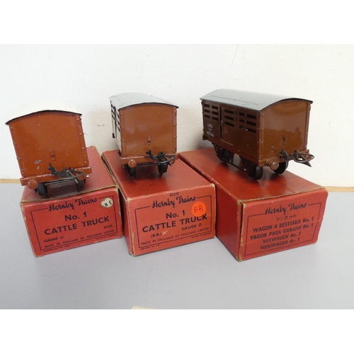 215 - Hornby. Tinplate models to include three boxed 0 gauge No.1 Cattle Trucks, a No.2 LNER black tank lo... 