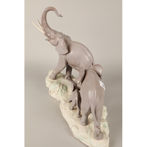 54 - Lladro large diorama a family of Elephants(One tusk damaged)