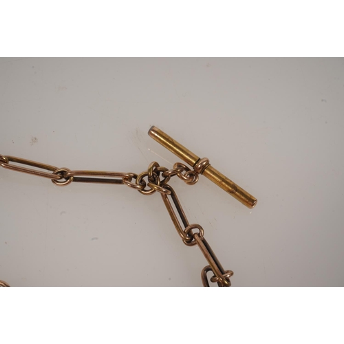 22 - Unhallmarked yellow metal watch guard chain of fetter link with Albert bar and brass fob 30g gross a... 