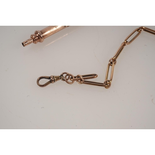 22 - Unhallmarked yellow metal watch guard chain of fetter link with Albert bar and brass fob 30g gross a... 