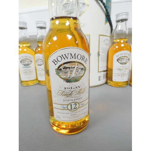 11 - Set of five bottles of Bowmore Islay Single Malt Scotch Whisky, 12, 15, 17 and 21 years old, and Leg... 