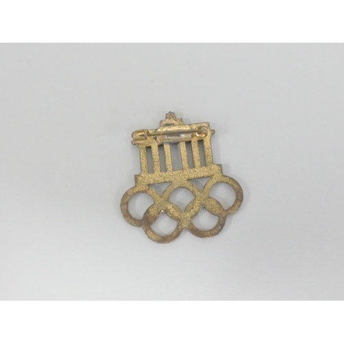 296 - Germany Third Reich. 1936 Berlin Olympics visitors badge. Steel base metal with gilt finish and infi... 